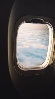 Stunning Airplane Window View Above the Clouds Mobile Wallpaper