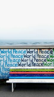 World Peace Aesthetic Wall With Colorful Bench Phone Wallpaper