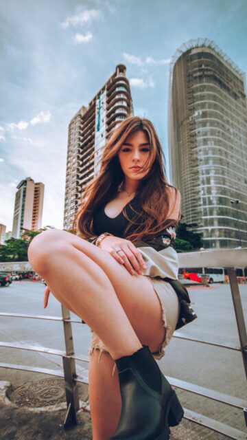 Stunning Fashion Portrait of a Beautiful Woman in Urban City Setting Wallpaper