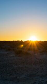 Golden Hour Sunset Over Sandy Dunes Coastal Landscape Wallpaper