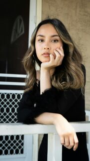 Stunning Young Woman Posing Reflectively Portrait Wallpaper