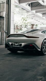 Silver Aston Martin Vantage Sports Car Rear View Mobile Wallpaper