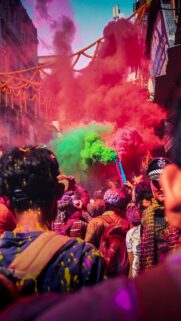 Vibrant Holi Festival Celebration with Colorful Smoke Clouds Wallpaper