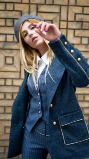 Stylish Blonde Woman in Elegant Blue Suit and Beret Mobile Wallpaper