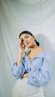 Elegant Woman in Blue Striped Blouse Portrait Phone Wallpaper