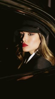 Stunning Fashionable Woman in Black Captain Hat Mobile Wallpaper