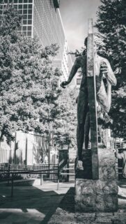 Stunning Bronze Runner Statue Urban Architecture Phone Wallpaper