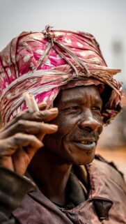 Stunning Portrait of an Elderly Man in Traditional Headscarf Wallpaper