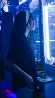 Girl Playing Arcade Claw Machine Neon Aesthetic Mobile Wallpaper