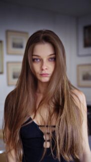 Stunning Portrait of a Young Woman with Long Brown Hair Mobile Wallpaper