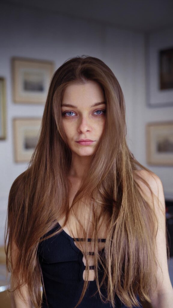 Stunning Portrait of a Young Woman with Long Brown Hair Mobile Wallpaper