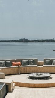 Luxury Mediterranean Coastal Lounge with Fire Pit Phone Wallpaper