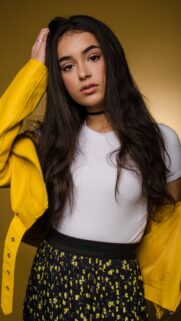 Beautiful Young Woman in Yellow Leather Jacket Portrait Wallpaper for Mobile