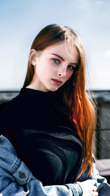 Stunning Portrait of a Redheaded Girl with Freckles and Blue Eyes Wallpaper