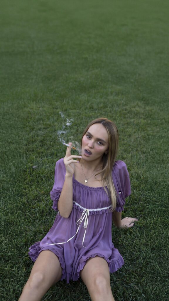 Lily Rose Depp Purple Dress Aesthetic Wallpaper for Mobile