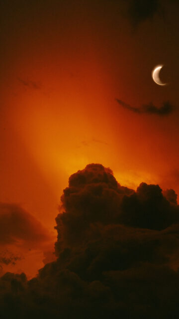 Fiery Crescent Moon Celestial Magic and Spiritual Energy Wallpaper