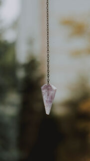 Amethyst Crystal Pendulum for Spiritual Clarity and Healing Energy Wallpaper