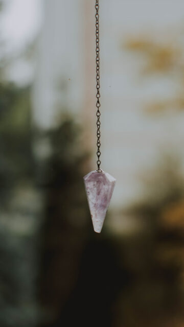 Amethyst Crystal Pendulum for Spiritual Clarity and Healing Energy Wallpaper
