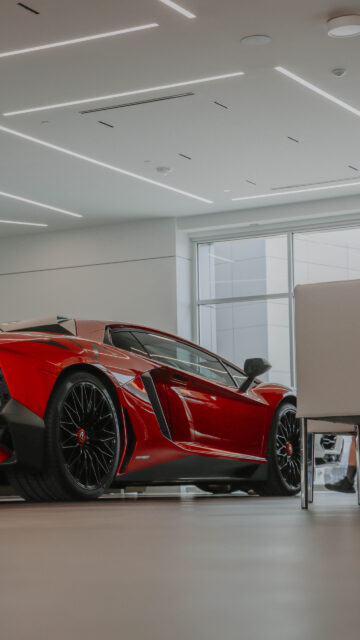 Red Lamborghini Vision Board for Wealth and Luxury Success Wallpaper