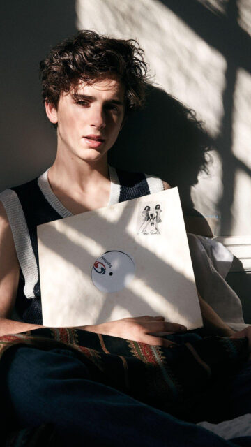 Timothée Chalamet Holding a Vinyl Record Mobile Wallpaper