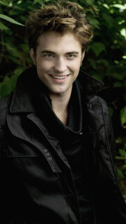 Portrait of a smiling young man in a black coat Mobile Wallpaper