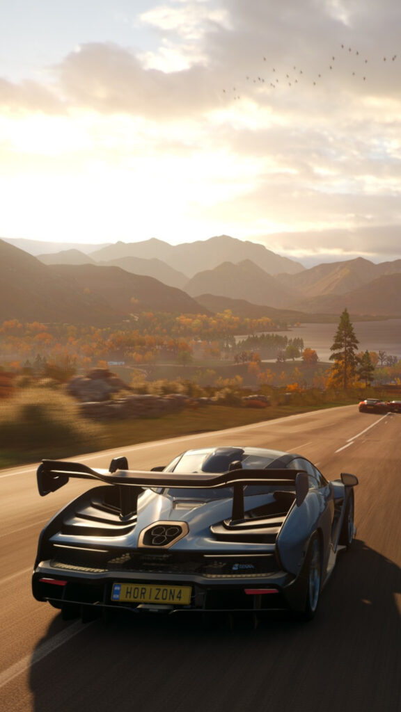 McLaren Senna Driving Through Autumn Mountains Mobile Wallpaper