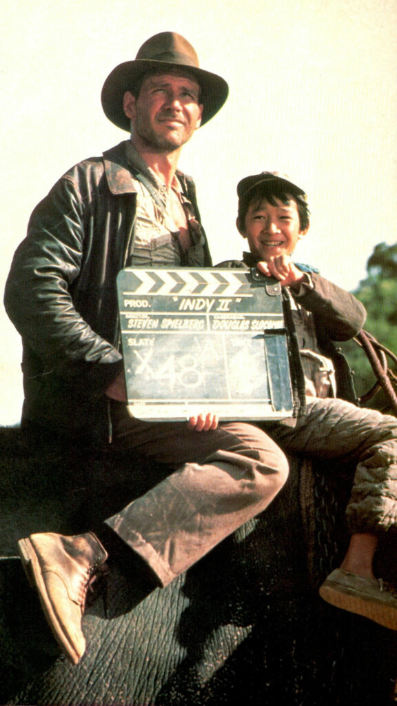 Harrison Ford and Ke Huy Quan Film Set Mobile Wallpaper