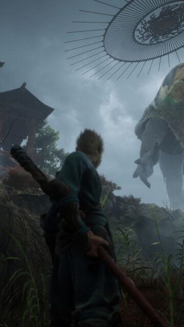 Sun Wukong Standing Against a Colossal Giant Mobile Wallpaper