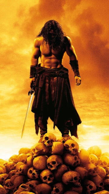 Conan the Barbarian Standing on Skulls Mobile Wallpaper