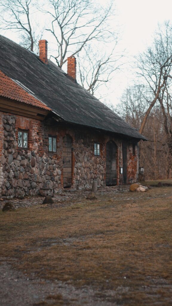 Rustic Stone Farmhouse in Forest Landscape Phone Wallpaper