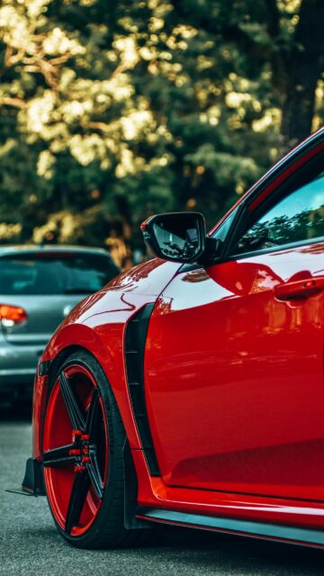 Stunning Red Sports Car Close-Up Mobile Phone Wallpaper