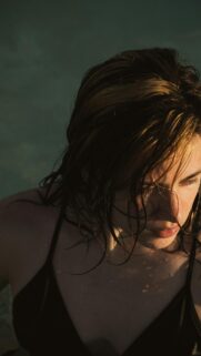 Stunning Close-up Portrait of Woman with Wet Hair in Water Mobile Wallpaper