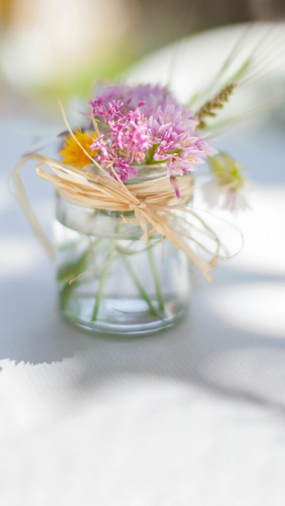 Charming Wildflower Bouquet in Glass Jar Mobile Wallpaper