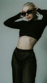 Stylish Blonde Woman in Black Crop Top and Sunglasses Portrait Wallpaper