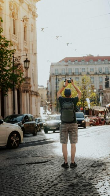 Photographer Exploring Lisbon Streets Mobile Phone Wallpaper