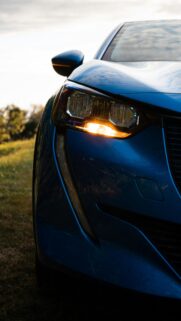 Blue Peugeot Car Front Headlight Close-up Mobile Wallpaper
