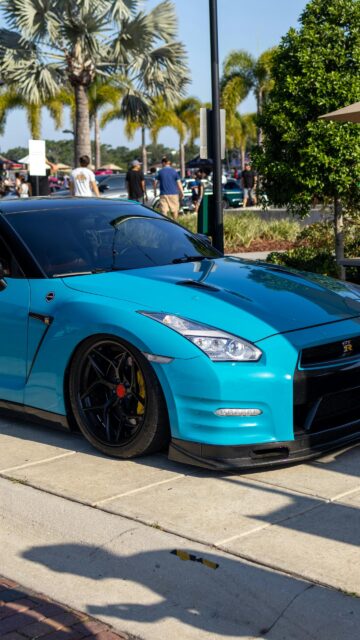 Vibrant Teal Nissan GT-R R35 Sport Car Mobile Phone Wallpaper