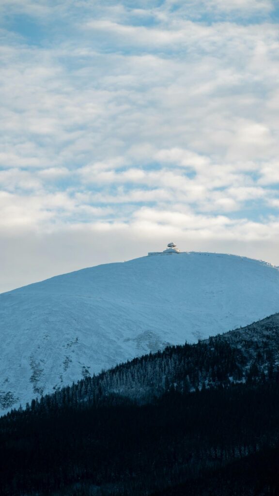 Snowy Mountain Peak with Alpine Observatory Mobile Wallpaper