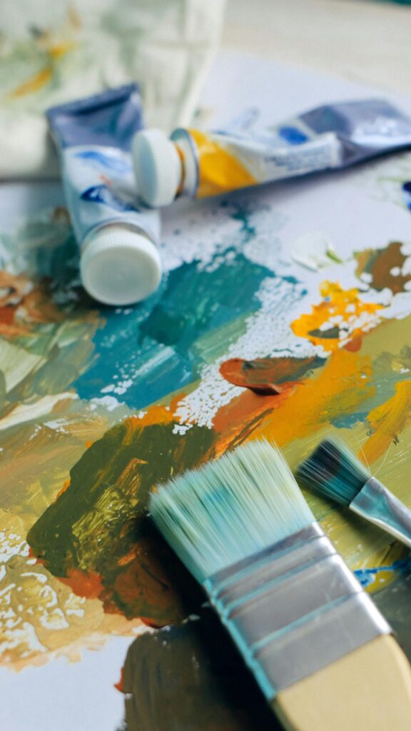 Artistic Oil Painting Palette with Brushes and Paint Tubes Wallpaper
