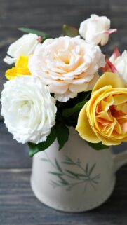 Stunning Bouquet of Pastel and Yellow Roses in Vintage Vase Wallpaper