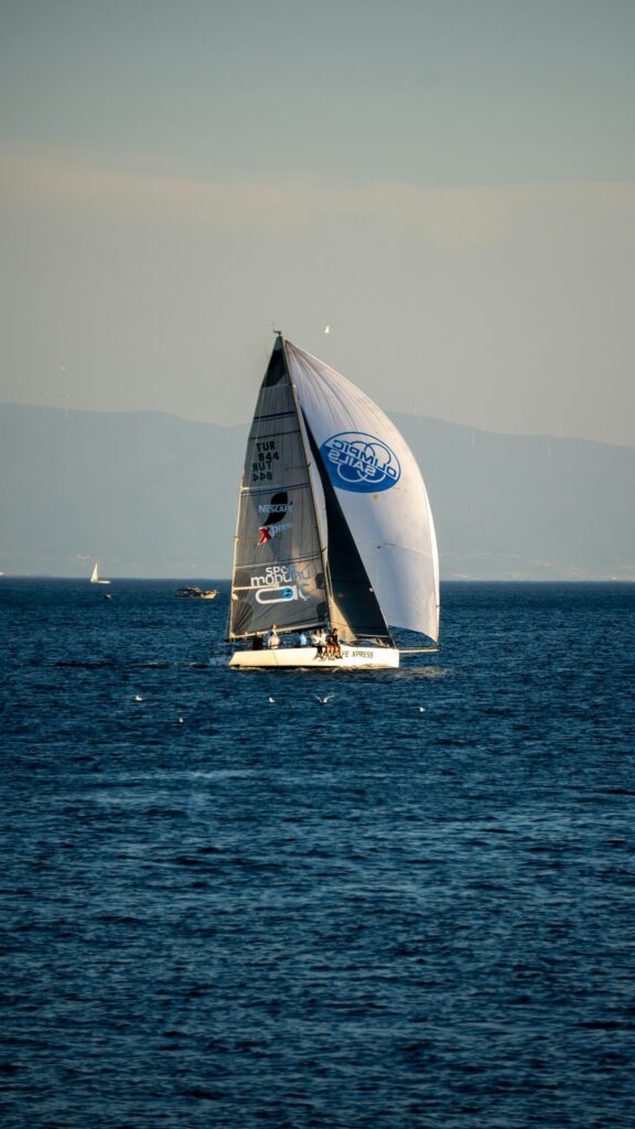 Professional Sailing Yacht on Deep Blue Ocean High Resolution Wallpaper