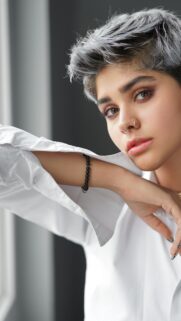 Stunning Short-Haired Person with Piercings Portrait Wallpaper