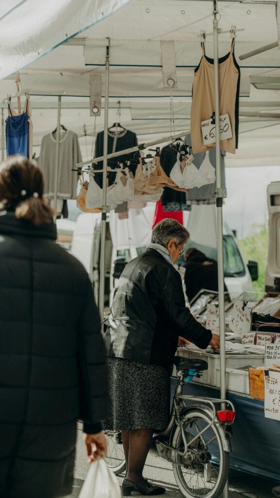 Elderly Woman Shopping at an Italian Outdoor Market Street Photography Wallpaper
