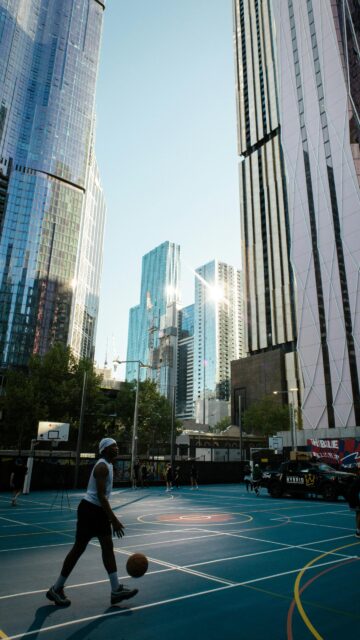 Urban Basketball Court in Melbourne Cityscape 4K Phone Wallpaper