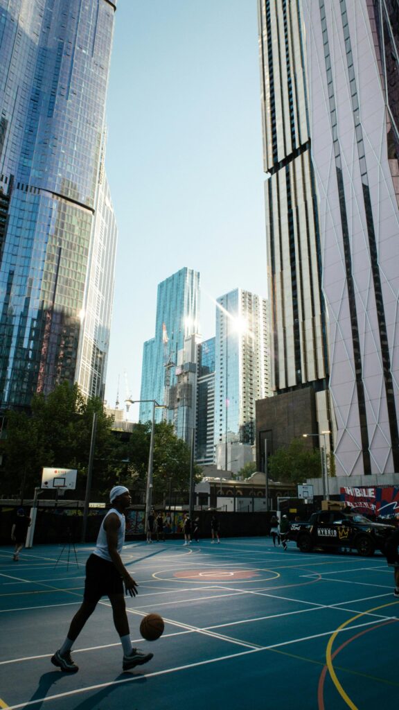 Urban Basketball Court in Melbourne Cityscape 4K Phone Wallpaper