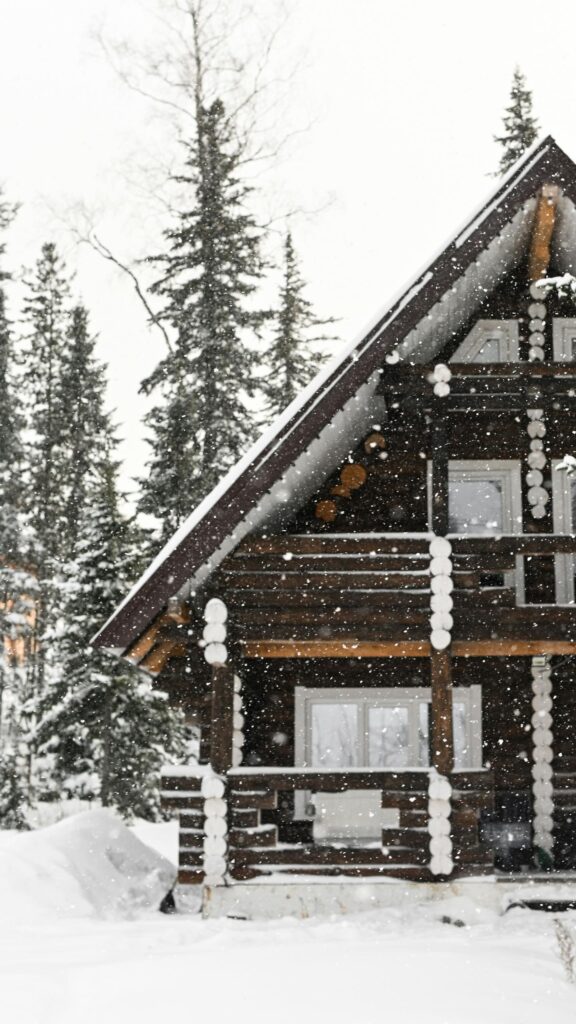 Cozy Snowy Log Cabin in Winter Forest Phone Wallpaper