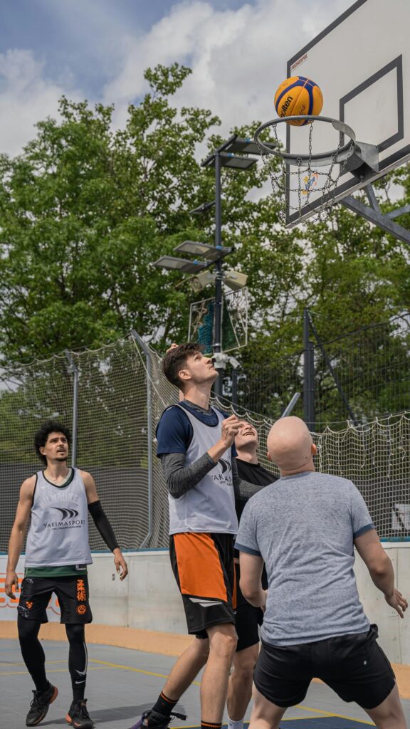 Three Men Playing Street Basketball Outdoor Sport Wallpaper