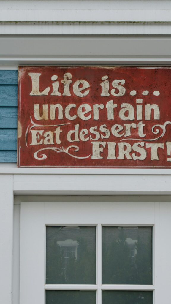 Life is Uncertain Eat Dessert First Red Sign Motivational Wallpaper