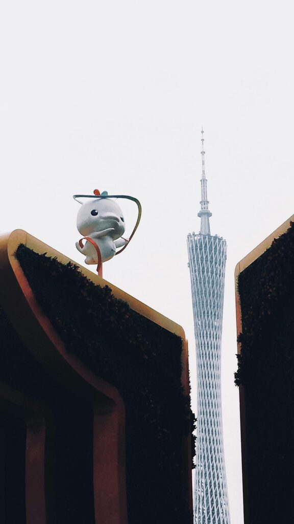 Canton Tower Landmark with Cute Mascot Statue Mobile Wallpaper