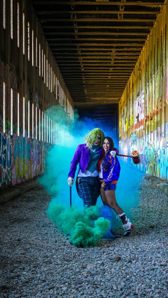 Joker and Harley Quinn Cosplay Couple in Graffiti Tunnel Wallpaper